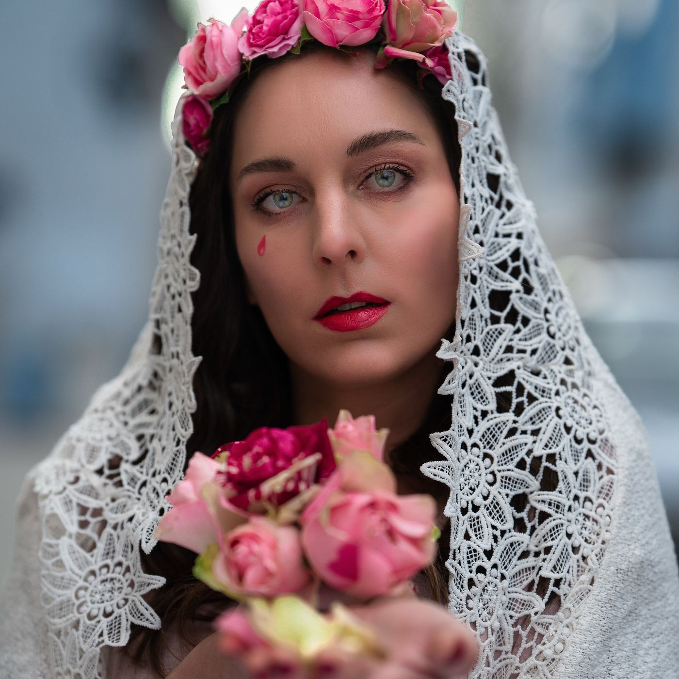 Portrait in a lace veil with roses